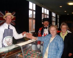 Andrew Shufflebottom of Cheerbrook Farm Foods is seen giving local Member of Parliament Gwynneth Dunwoody some bacon