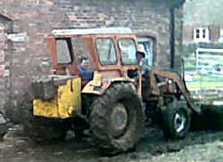 Josh hiding behind tractor