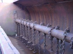 Spreader rotor shaft and chains