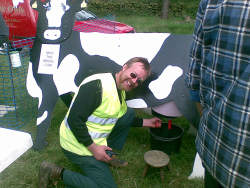 Mick milking cow